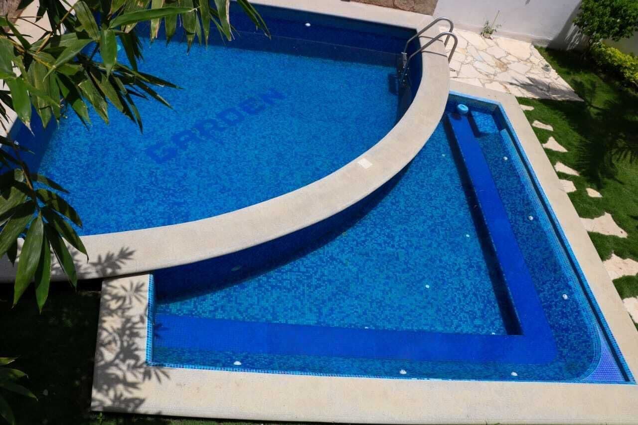 Outdoor pool, open 7:00 AM to 10:00 PM, pool umbrellas, sun loungers