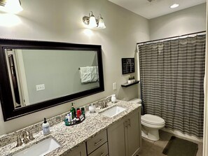 Combined shower/tub, towels, shampoo, toilet paper