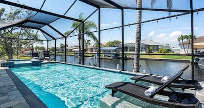 Gulf access pet friendly waterfront oasis with NEW heated salt water pool & spa
