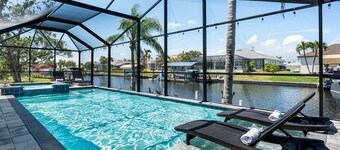 Gulf access pet friendly waterfront oasis with NEW heated salt water pool & spa