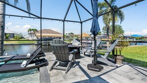 Outdoor dining - Gulf access pet friendly waterfront oasis with NEW heated salt water pool & spa (Cape Coral)