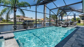 Outdoor pool, a heated pool - Gulf access pet friendly waterfront oasis with NEW heated salt water pool & spa (Cape Coral)