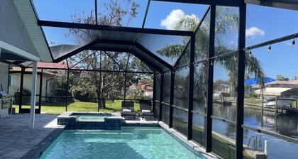 Gulf access pet friendly waterfront oasis with NEW heated salt water pool & spa