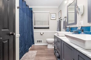 Bathtub, hair dryer, towels
