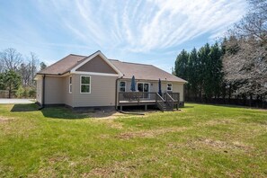 A single-story house with a front deck and a covered porch. - "Murray Mill Ranch" — Classy ranch retreat next to Murray Mill; quiet & private (Catawba)