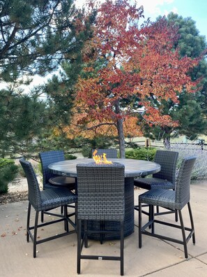 Relax in a serene outdoor setting surrounded by trees and a natural backdrop.