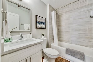 Combined shower/bathtub, hair dryer, towels, soap
