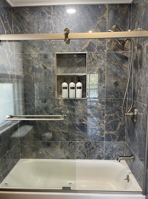 Shower, hair dryer, towels, soap