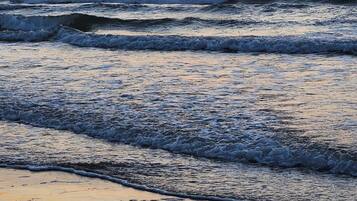 On the beach, sun loungers, beach towels