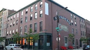 A multi-story building with a sign reading "KSTRAUS & CO." and "HAVANA."