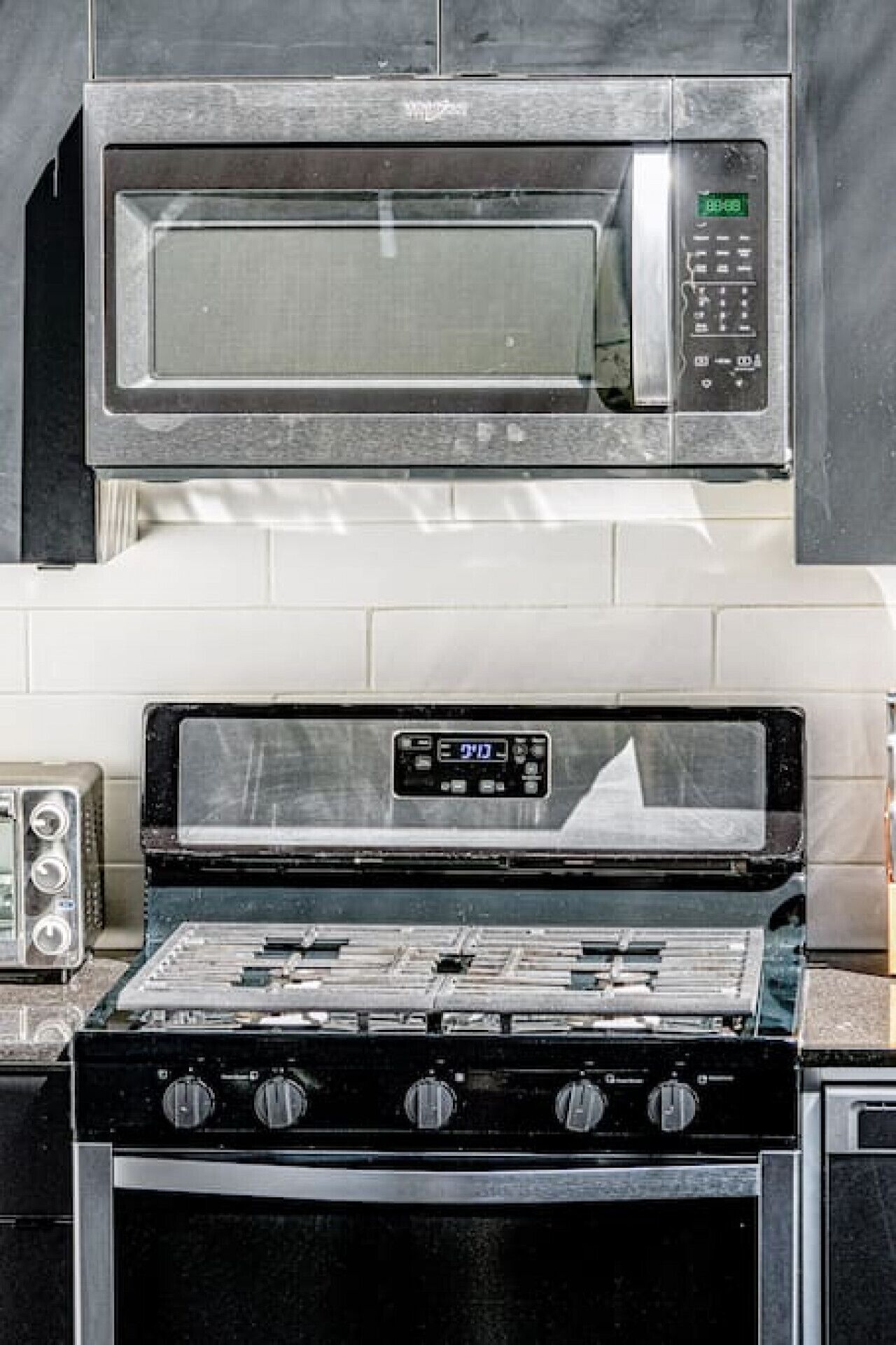 A kitchen with a microwave and a stove.