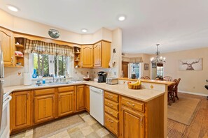 Enjoy cooking and dining in this well-equipped kitchen with a central island and dining area.