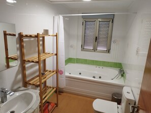 Bathtub, jetted tub, hair dryer, towels