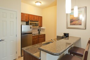 Fridge, microwave, stovetop, dishwasher - Two Bedroom Suite | Extended Stay Comfort (Lafayette)
