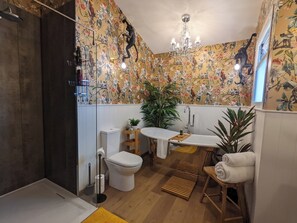 Bathtub, hair dryer, towels, soap