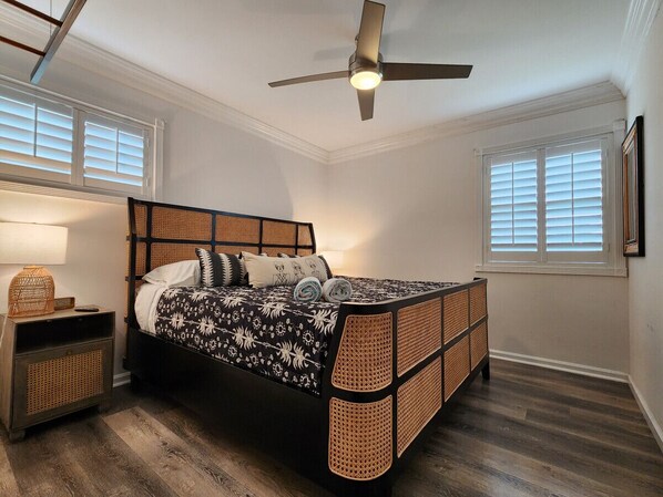 A bedroom with a bed, nightstand, and ceiling fan. - 9702 · Fairytale Escape -Disney Pool Retreat Unwind&Relax (Anaheim)