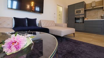 Family Suite | Living area | Flat-screen TV