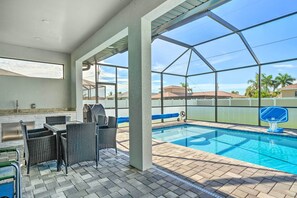 Relax by the tranquil pool, surrounded by a peaceful neighborhood view.