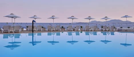Seasonal outdoor pool, open 9:00 AM to 7:00 PM, pool umbrellas
