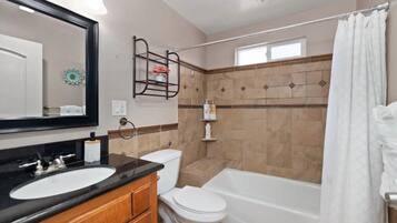 Combined shower/bathtub, hair dryer, towels, soap