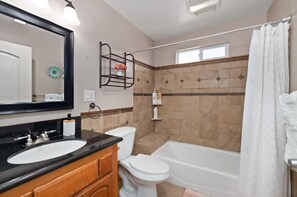 Combined shower/tub, hair dryer, towels, soap