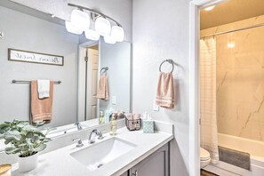 A bathroom with a white sink, a mirror, and a shower. - Golf Course Views & Pool Access: Glendale Condo! (Glendale)