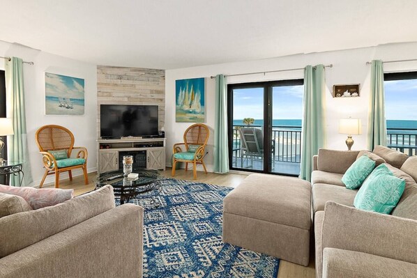 Smart TV - Discover paradise at Seascape Towers in New Smyrna Beach. This 3BR/2BA oceanfront condo features a remodeled walk-in shower, spacious layout, and wraparound balcony with sweeping views—just steps from the sand and local attractions. (New Smyrna Beach)