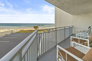 Property grounds - Discover paradise at Seascape Towers in New Smyrna Beach. This 3BR/2BA oceanfront condo features a remodeled walk-in shower, spacious layout, and wraparound balcony with sweeping views—just steps from the sand and local attractions. (New Smyrna Beach)