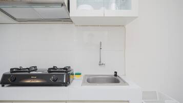 Apartment | Private kitchen | Fridge, stovetop, cookware/dishes/utensils, dining tables