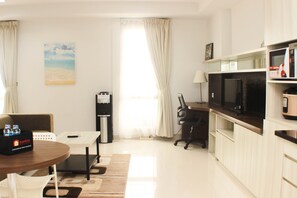 Apartment | Living area | TV - Cozy Studio At Azalea Suites Apartment (Cikarang)