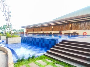 Outdoor pool - Cozy Studio At Azalea Suites Apartment (Cikarang)
