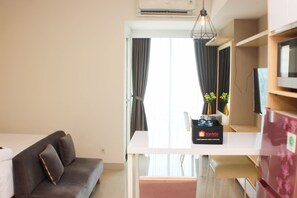 Living area - Cozy And Warm Studio At Grand Kamala Lagoon Apartment (Bekasi)