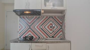 Departamento, 2 habitaciones | Cocina privada | Refrigerador y utensilios de cocina