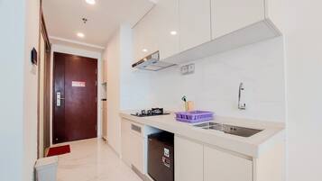 Apartment | Private kitchen | Fridge, stovetop, electric kettle, cookware/dishes/utensils