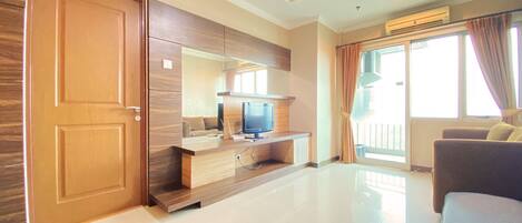 Apartemen, 1 kamar tidur | Area keluarga | TV