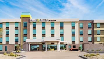 Welcome to Home2 Suites by Hilton, where guests can enjoy a convenient entrance and comfortable seating area.
