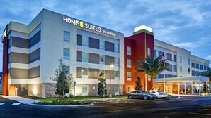 A multi-story hotel with a modern design, featuring a prominent 'Home Suites by Hilton' sign. - Home2 Suites by Hilton Scottsdale North (Scottsdale)