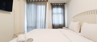 Cozy And High Floor Studio Room At Vida View Makassar Apartment