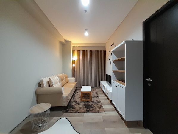 Appartement, 1 chambre | Coin séjour | Télévision