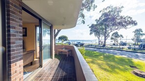 Enjoy a tranquil retreat with an outdoor seating area overlooking the ocean.