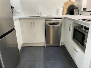 Coffee/tea maker, fridge, microwave, oven