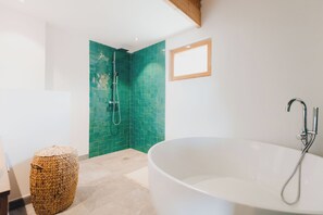 Bathtub, hair dryer, towels, soap