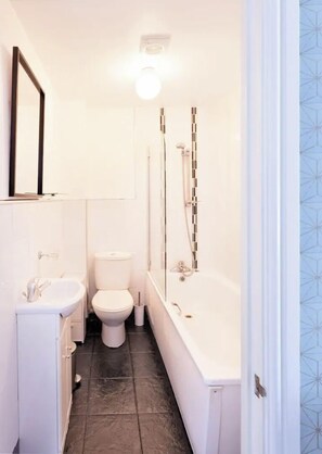 Bathtub, hair dryer, towels, soap