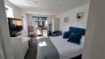 1 bedroom, desk, iron/ironing board, travel crib