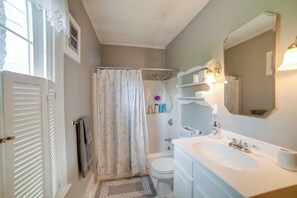 A bathroom with a shower, toilet, sink, and towel rack. - Kennebunk Apartment w/ Local Beach Access! (Kennebunk)