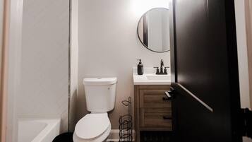 Combined shower/tub, hair dryer, towels, soap