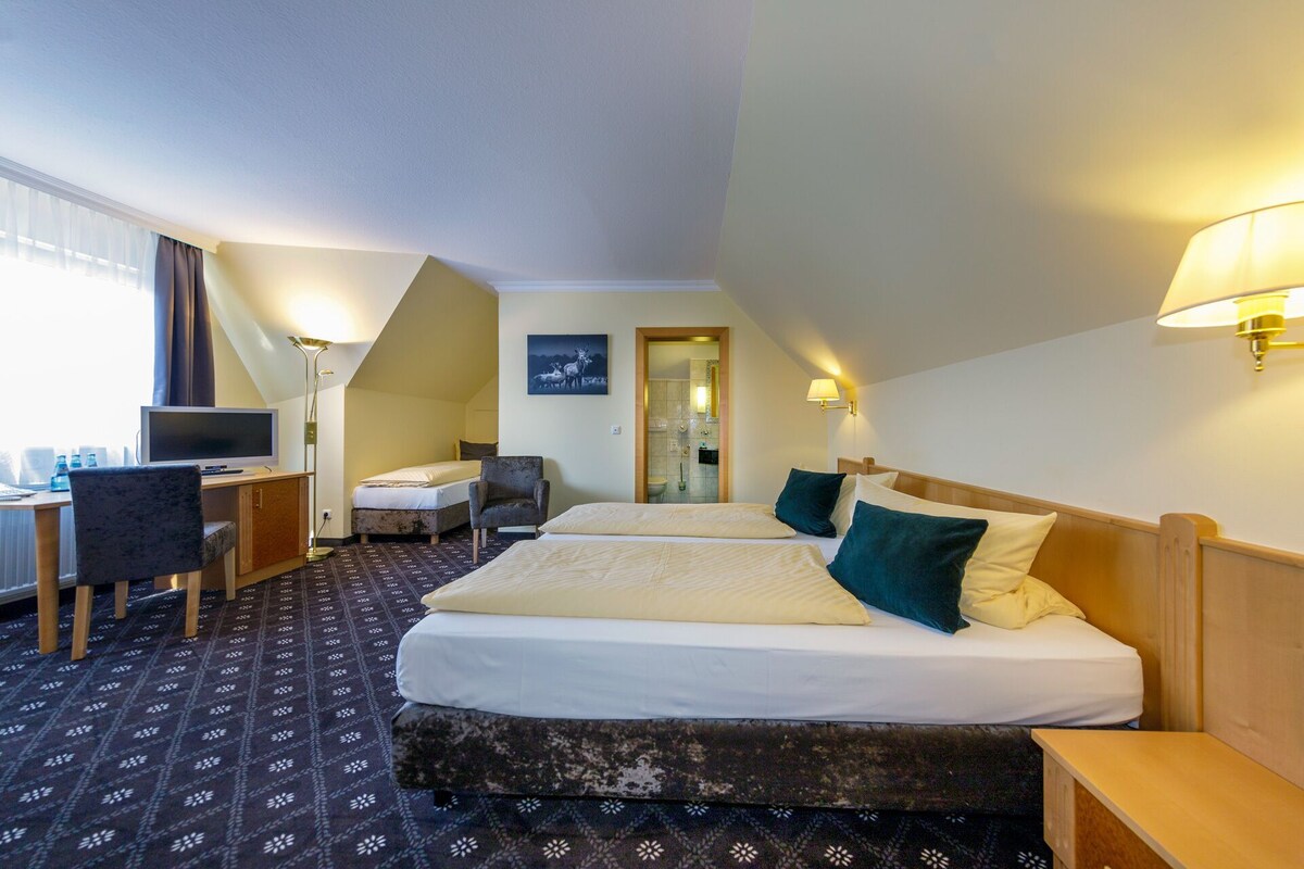 Premium bedding, desk, laptop workspace, soundproofing