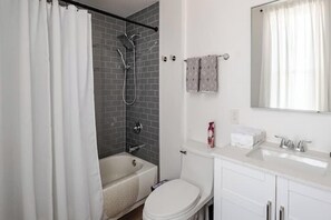Combined shower/bathtub, hair dryer, towels, soap