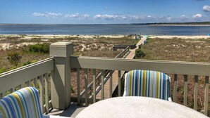 A balcony with a view of a beach and ocean. - Seabrook Exclusives | 1302 Pelican Watch (Seabrook Island)