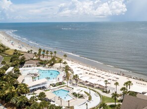 Relax by the large central pool surrounded by sun loungers and shaded areas, with access to the ocean.
